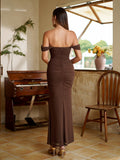 Back view of a model in a long brown ruched off-the-shoulder dress