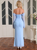 Back view of a woman in a light blue ruched mermaid maxi dress with long sheer sleeves