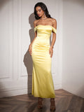 Full-body shot of a woman in an elegant yellow gown