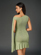 Back view of a lime green one-shoulder sheath dress with draped sleeve detail and ruffled hem.