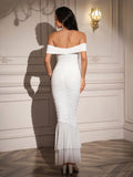 Back view of a woman in a white off-the-shoulder ruched mermaid gown