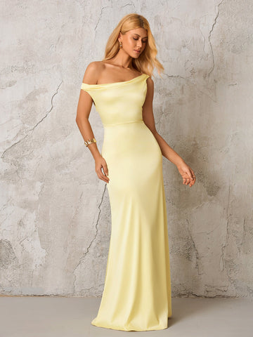 Woman wearing a pale yellow satin one-shoulder floor-length gown