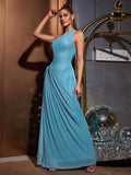 Woman posing in a blue asymmetrical neckline maxi dress