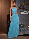 Front view of a woman modeling a blue metallic knit maxi dress