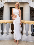 Front view of a woman in a white one-shoulder crepe dress with cut-out detail and ruched tie waist, with a handbag.