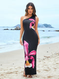 Front view of a woman wearing a black one-shoulder floral print maxi dress on the beach.