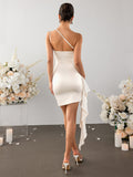 Back view of a cream one-shoulder satin sheath dress with draped detailing.