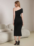 Back view of a woman in a black one-shoulder ruched sheath dress
