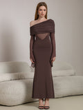 Full-length shot of a woman in an elegant brown evening gown