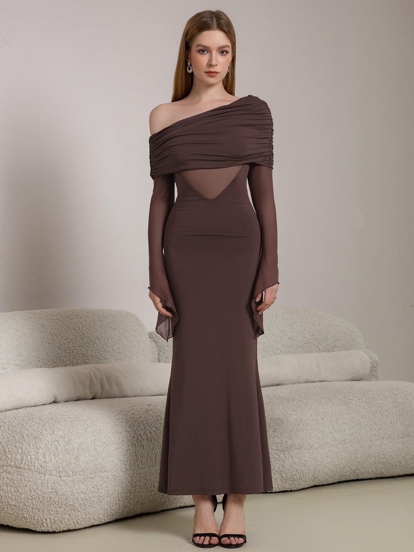 Full-length shot of a woman in an elegant brown evening gown