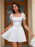 Woman in a white short dress with puff sleeves and a square neckline, twirling.