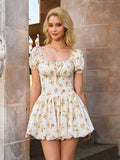 Woman wearing a cream floral print mini dress with puff sleeves and a smocked bodice.