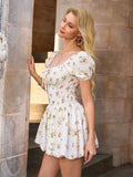 Side view of a woman in a cream floral print mini dress with a smocked bodice and puff sleeves.