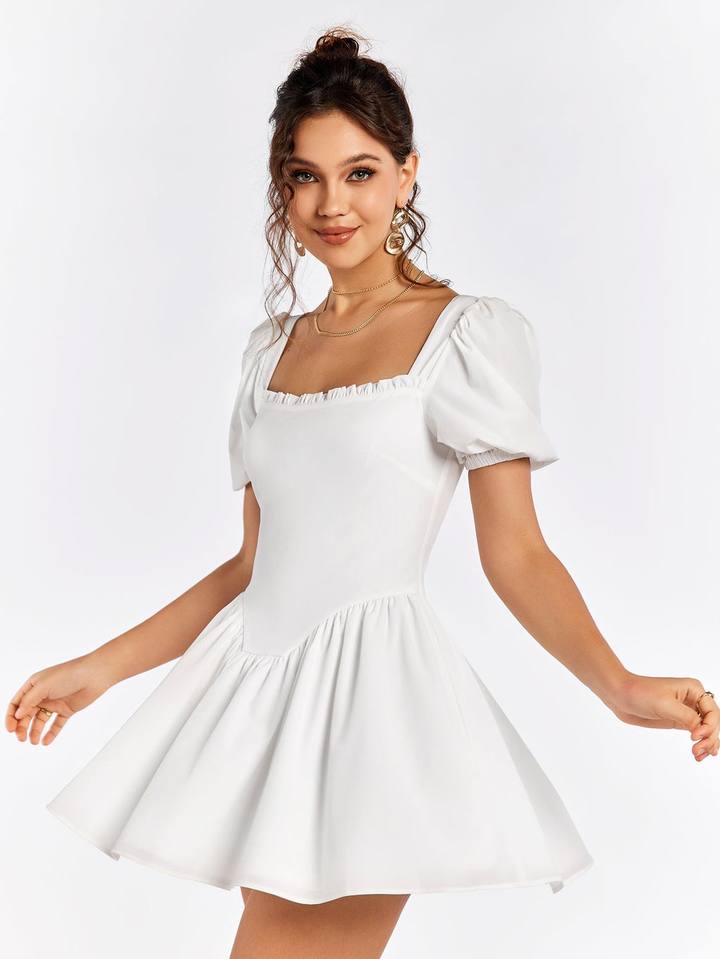 Woman twirling in a white short dress with puff sleeves and a square neckline