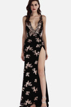 Woman in a black sequined V-neck, sleeveless evening gown with a high leg slit and open back.
