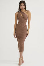 Full-length view of woman in a brown asymmetrical one-shoulder ruched bodycon midi dress with a corset bodice