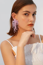 Woman with lavender beaded chandelier earrings