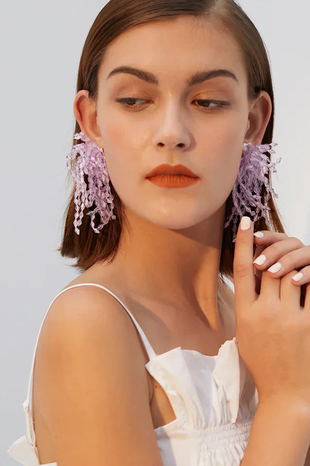 Close-up of lavender beaded chandelier earrings