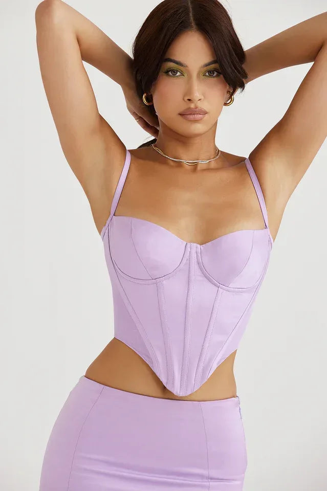 Model wearing a lavender faux leather corset top with spaghetti straps and a sweetheart neckline. Main image
