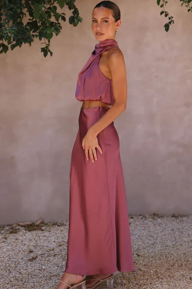 Side profile of woman in plum satin maxi skirt set