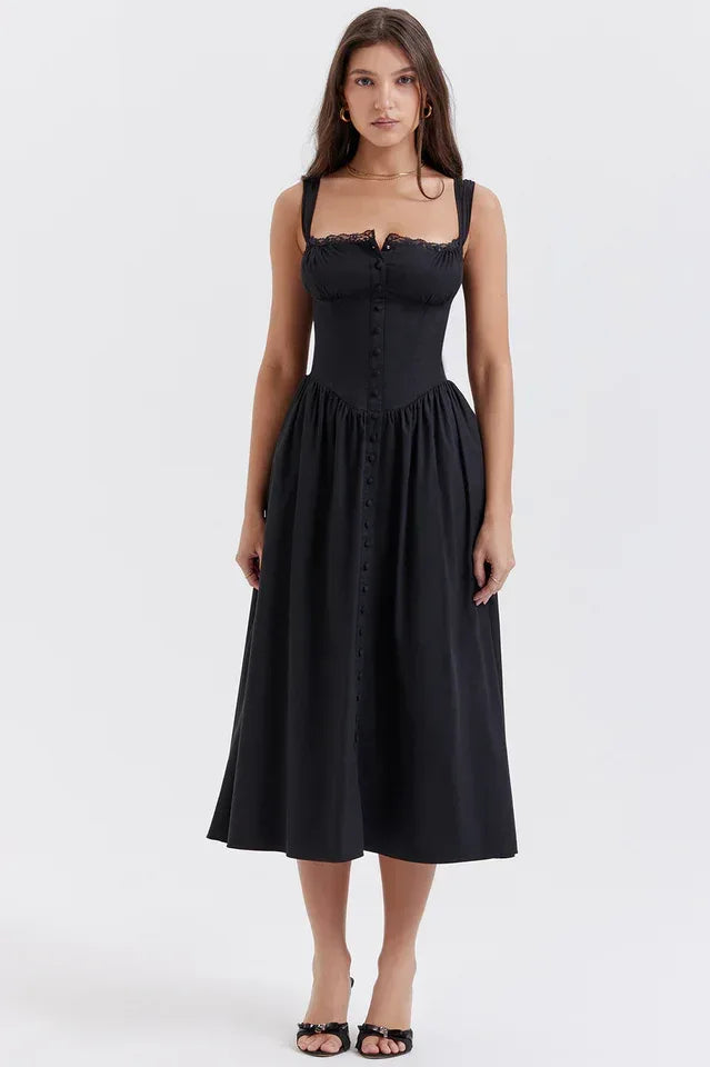Woman wearing a black sleeveless midi dress with a corset bodice and button front