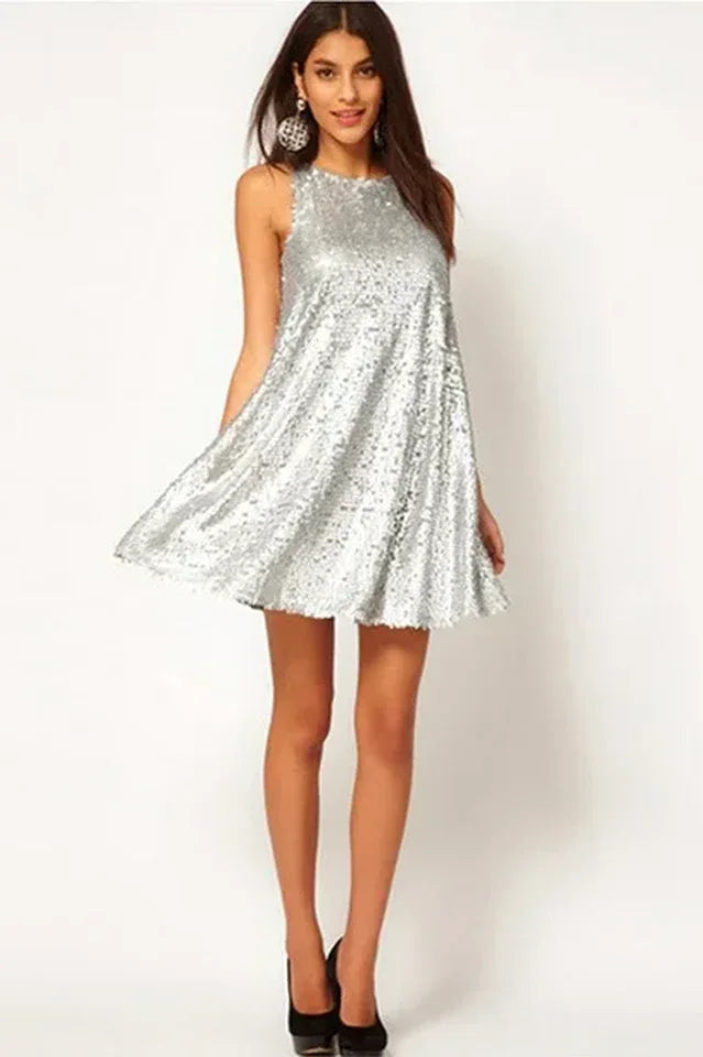 Woman modeling a silver sequined A-line mini dress with a round neckline