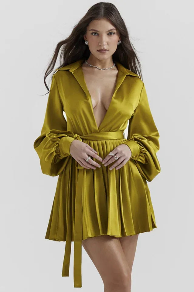 Woman wearing a green satin mini dress with long balloon sleeves and a collared V-neck. Main image