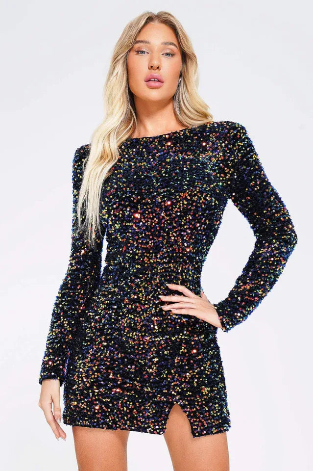 Woman wearing a black sequin dress with long sleeves and a high slit Main image