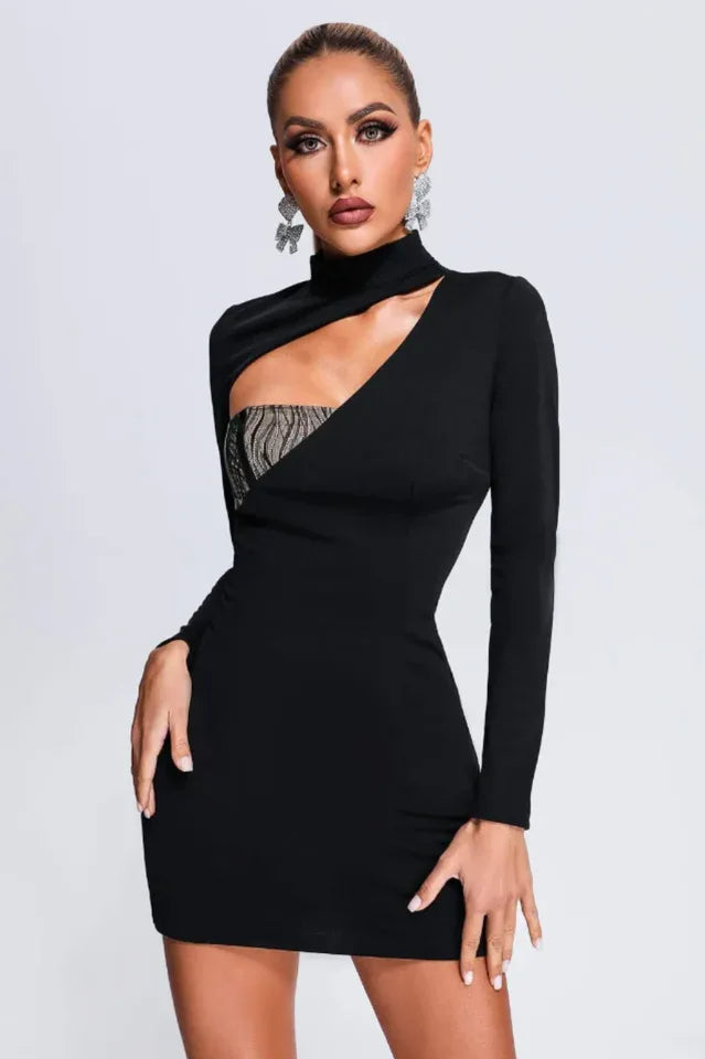 Woman wearing a black long-sleeve bodycon mini dress with a cutout detail at the neckline and a contrast panel insert. Main image