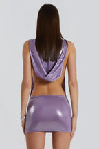 Back view of a woman in a purple hooded metallic mini dress
