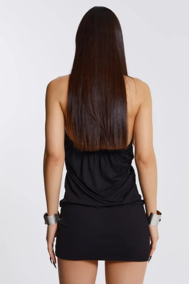 Back view of a woman in a black halter mini dress