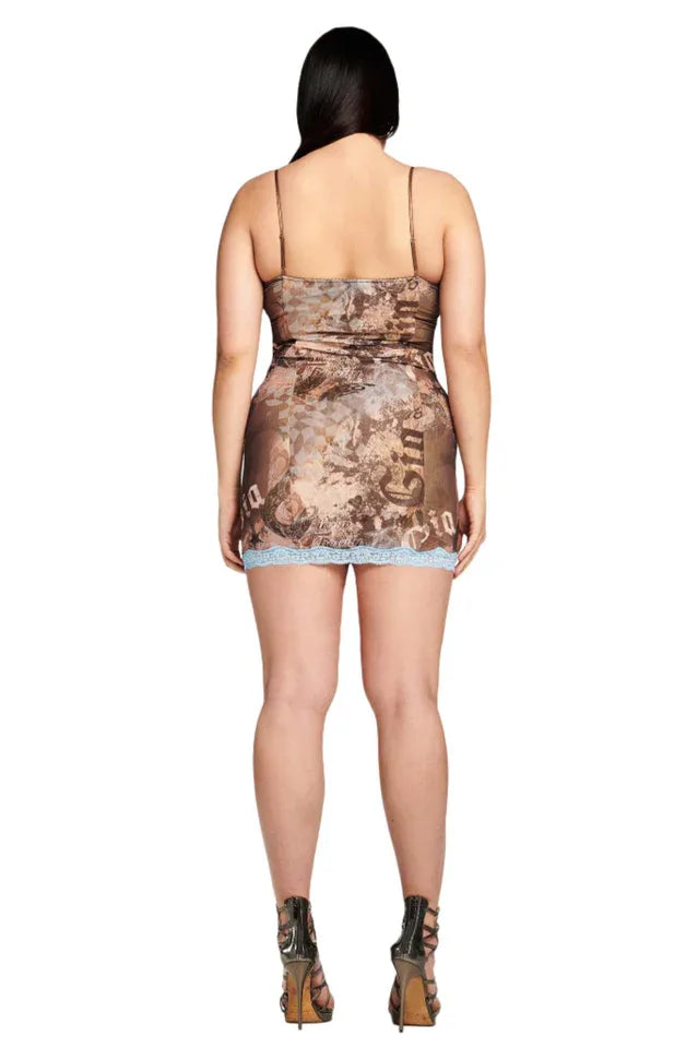 back view of a model in a brown graphic print mesh mini dress with blue lace trim
