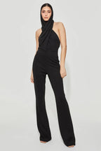 Black crepe jumpsuit with integrated hood and halter neckline