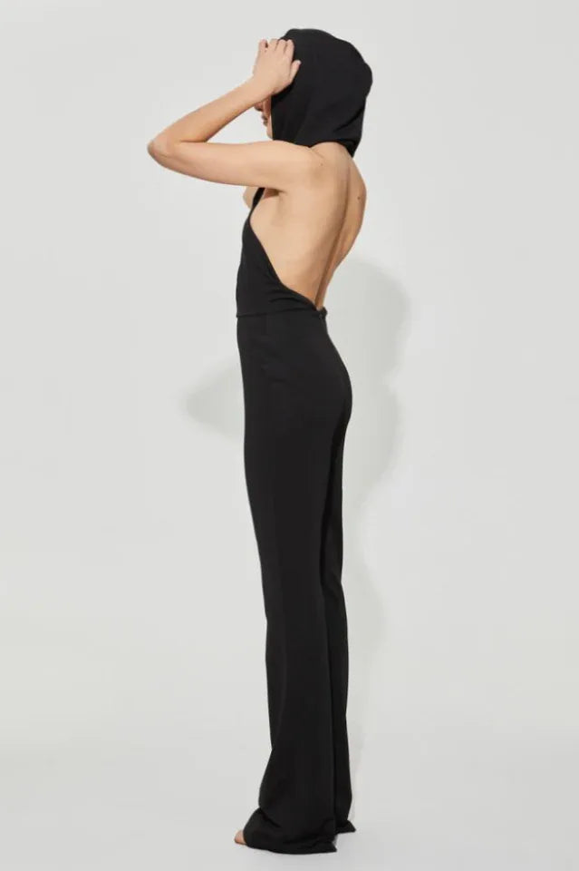 Back view of black jumpsuit with open back and halter neckline