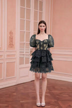 Back view of a woman in a white mini dress with a ruffled neckline and voluminous sleeves.