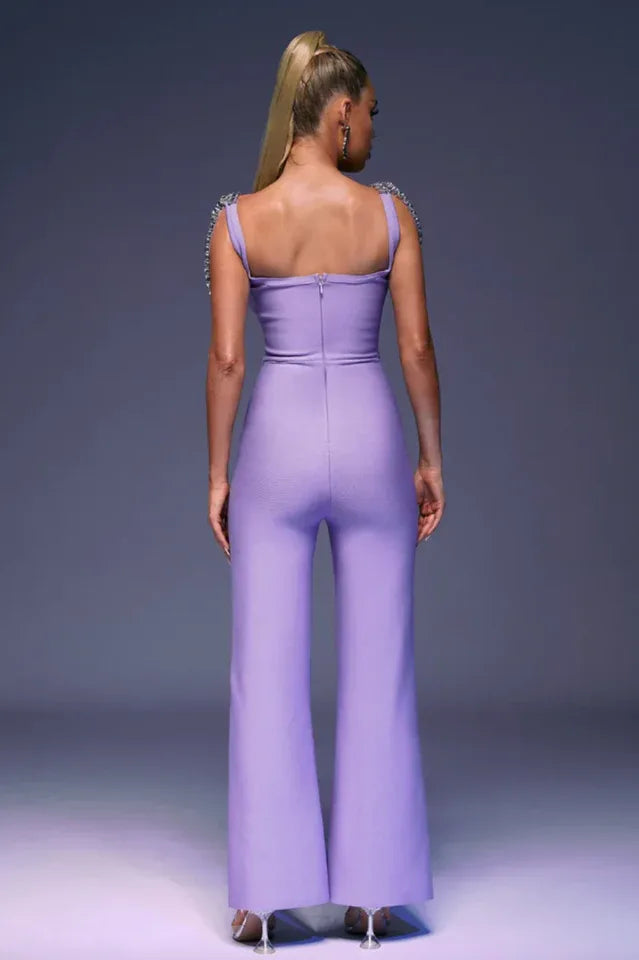 Back view of a woman in a lavender wide-leg jumpsuit with a zipper closure