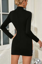 Detail shot of the pearl embellishments on the shoulders and sides of a black mini dress