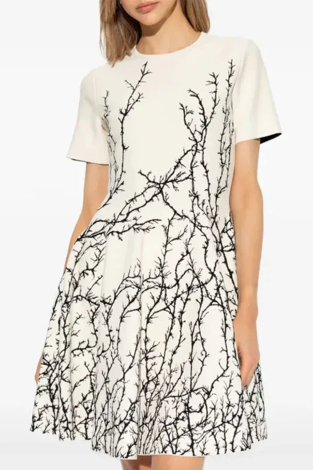 White dress with black branch print and short sleeves