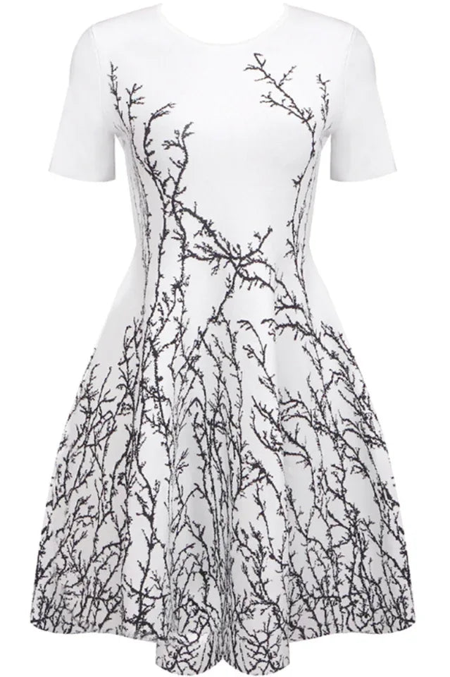 White fit-and-flare dress with a black branch pattern