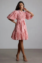 Side view of a woman showcasing the detail of a 3D floral dress