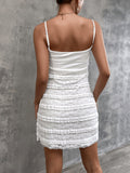 Back view of white ruched bodice mini dress with tiered ruffled skirt
