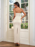 Rear view of a woman in an ivory strapless satin gown with a corset bodice and back slit.