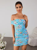 Woman wearing a blue floral off-the-shoulder ruched mini dress, front view