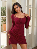 Close-up of a woman in a burgundy long-sleeved dress with a lace-up front and square neckline.