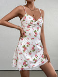 woman wearing a white A-line dress with cherry print, knot front, and spaghetti straps