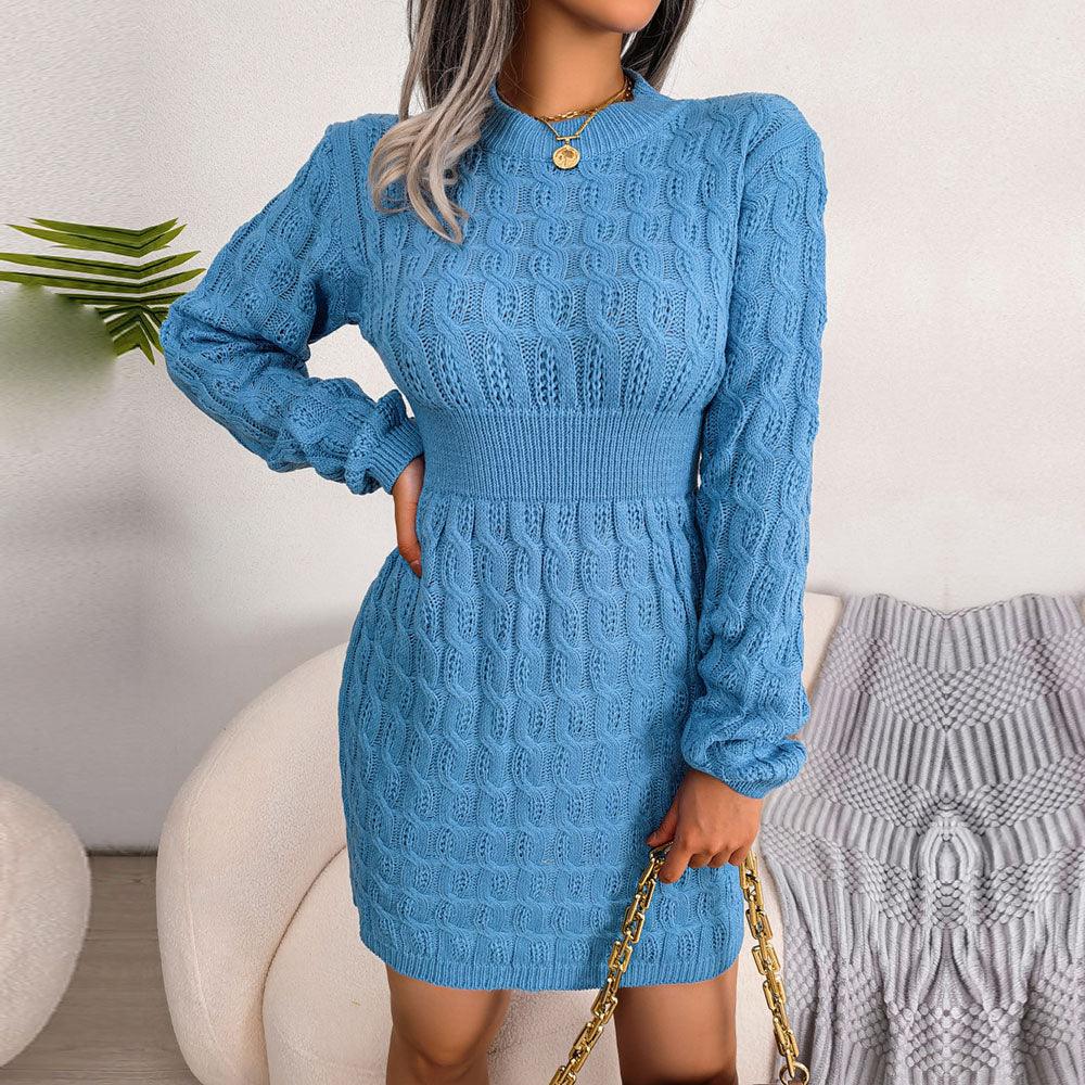 Side profile of a woman in a blue knit dress with a crew neck and long sleeves.