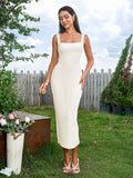 full length shot of woman in white sleeveless ribbed knit midi dress