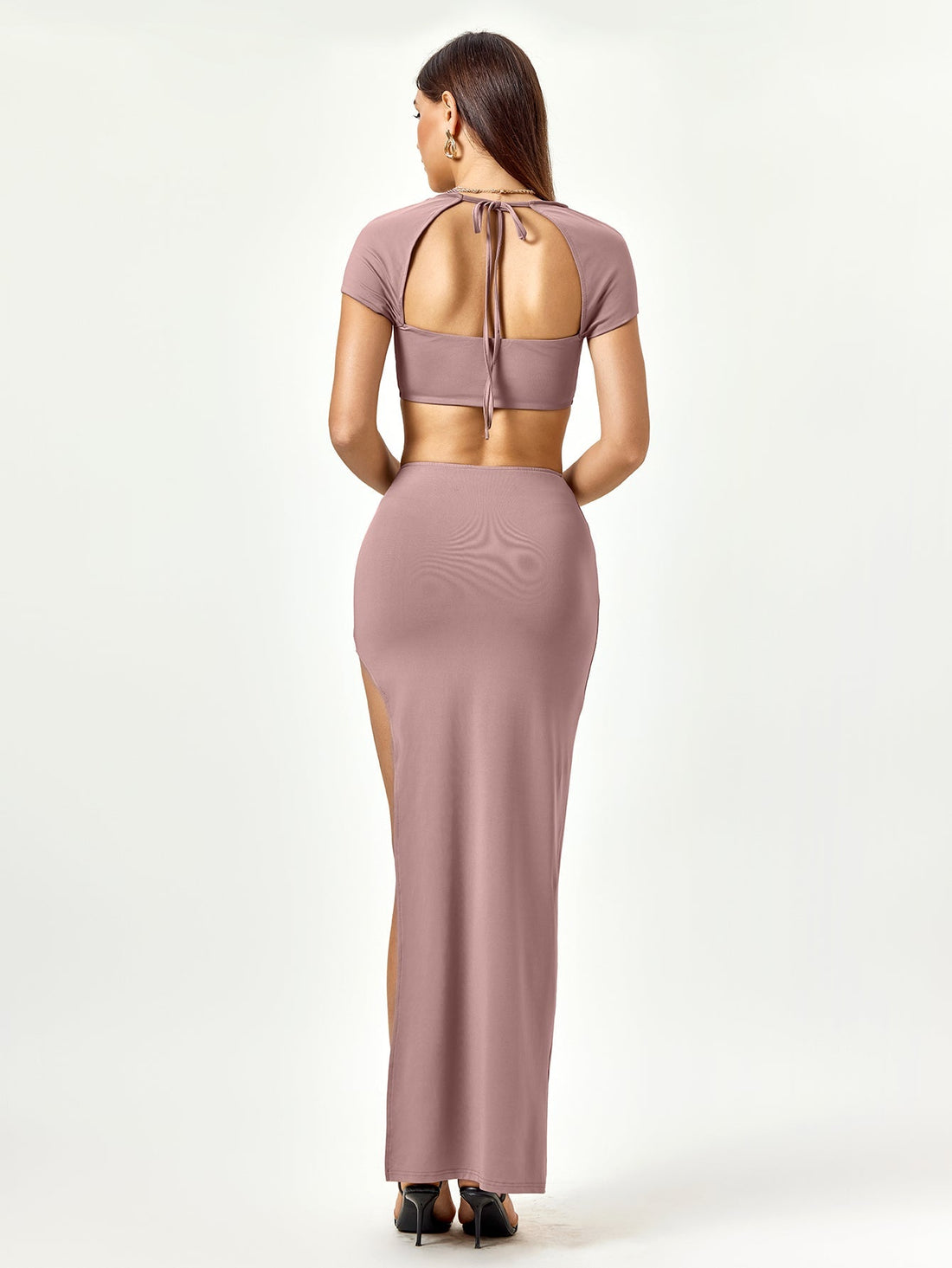 Woman wearing a mauve two-piece set with a square neck cropped top and a high slit maxi skirt.