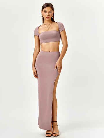 Woman wearing a mauve two-piece set with a square neck cropped top and a high slit maxi skirt.