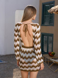 Back view of a woman in a knit cover-up dress with an open back and tie detail